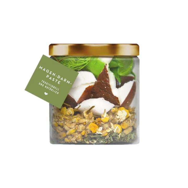 Jar of Magen-Darm Paste with herbs and a gold lid on a white background